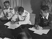 A Japanese Navy officer signing the surrender of Penang aboard HMS Nelson on September 2, 1945. Penang was liberated by the Royal Marines on the following day under Operation Jurist.