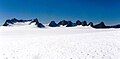 Mustang Peak and Dike Mountain to the left with unnamed nunataks to the right. Viewed from the Juneau Icefield.