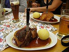 Schweinshaxe with Kartoffelknödel (potato dumplings) in Germany