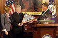 Speaker Boehner and Minority Leader Pelosi present Coughlin with a flag flown over the Capitol, 2011.