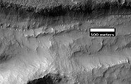 Close-up of gullies in trough, as seen by HiRISE under the HiWish program. These are some of the smaller gullies visible on Mars.