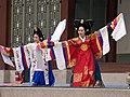 Dancers in wonsam performing a Korean dance, Taepyeongmu