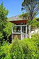 A multi-level tree house in Cape Town, South Africa, with an observation deck on top.