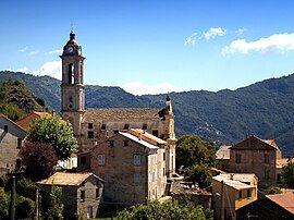 A view of the village and the parish church of the Annunciation, in Sermano