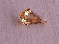 Yellow topaz in stepped kite-shaped cut