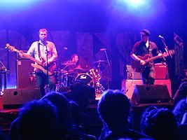 Doves performing live in 2009. From left to right: Jimi Goodwin, Andy Williams (on drums), and Jez Williams.