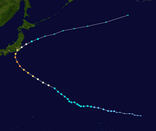 A track map showing the path of a powerful typhoon over the western Pacific Ocean. It moves in an erratic west-northwestward motion for much of its duration; it curves northward as it approaches Japan, briefly passing over the southeastern portion of the country. It then continues east-northeastward out to sea.