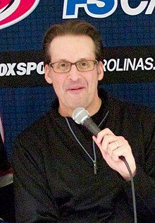 John Forslund holding a microphone