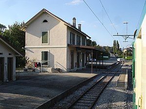 Two-story station building next to railway line