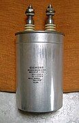 Power film capacitor for AC power-factor correction (PFC), packaged in a cylindrical metal can