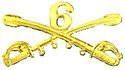 A computer generated reproduction of the insignia of the Union Army 6th Regiment cavalry branch. The insignia is displayed in gold and consists of two sheafed swords crossing over each other at a 45-degree angle, pointing upwards with a Roman numeral 6