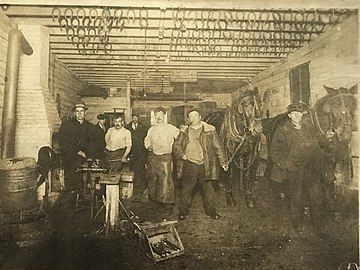 Workers in Ogden Park in the blacksmith shop