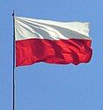 A Polish flag fluttering in the wind