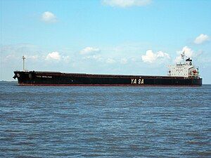 Image of cargo ship at sea. The words “NESLIHAN” and “YA-SA” are visible on the side of the vessel.