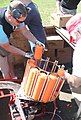 Clay targets being placed in an automatic throwing machine.