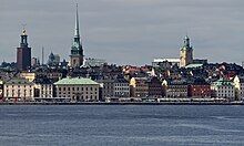 A landscape image of a city setting including a river.