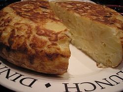 Tortilla de patatas cut in half.