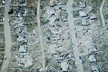 Aerial photograph of flattened homes