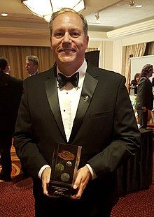 William Ledbetter holding the Nebula Award for his novelette "The Long Fall Up"