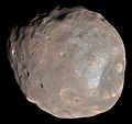 Image 1 Phobos (moon) Photo credit: Mars Reconnaissance Orbiter Phobos, the larger and closer of the two moons of Mars, as seen from about 6,000 kilometres (3,700 mi) away. A small, irregularly shaped object, Phobos orbits about 9,377 km (5,827 mi) from the center of Mars, closer to its primary than any other planetary moon. The illuminated part of Phobos seen in the images is about 21 km (13 mi) across. The most prominent feature in the images is the large crater Stickney in the lower right. With a diameter of 9 km (5.6 mi), it is the largest feature on Phobos. More selected pictures