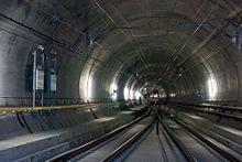 Ballastless track of the type "Low Vibration Track" with rails fastened to concrete sleepers on a concrete slab in a turnout in the Gotthard Base Tunnel's Faido multifunction station.