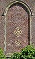 Examples of rune-shaped designs found on Ledringhem's church (a five-lozenges cross and a heart on the gable)