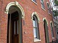 Rounded window cornices are a common feature of Italianate architecture.