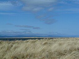 Rubh' na h-Innse Moire in the foreground with Innis Mhòr beyond and the hills of Sutherland in the background.