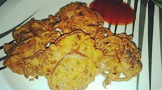 Onion fritters (Peyaji) are a Bengali dish made with onions