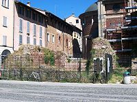 Close-up of remains with a plaque showing its original form