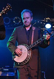 Jem Finer performing as part of The Pogues in 2010