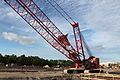 A Manitowoc Lattice Crawler, more specifically a Manitowoc Model 999, crane at a parking garage construction site.