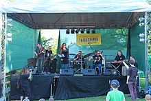 Petr Kumandžas with Půlnoc playing bass guitar (second from left)