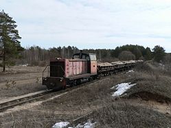 Locomotive TU7-1703 with freight train