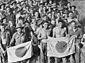 Image 6Australian soldiers display Japanese flags they captured at Kaiapit, New Guinea in 1943 (from History of the Australian Army)