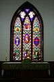 The altar and central stained glass window