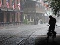 A wet River Street. The in-view Kevin Barry's Pub closed in the new year of 2020 after nearly forty years in business[17]