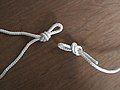 Make a loop knot on one end of the rope and another loop knot in the middle, just shorter than the area to be bound. (An overhand loop knot can be used here, but a Butterfly Knot works better because it doesn't jam when strained and it's easy to untie.)