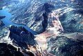 Areal photo of the inundated town of Thistle, the landslide, and the construction to re-route the severed transportation arteries around the slide.