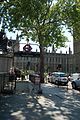 Westminster tube station entrance on Victoria Embankment with Palace of Westminster in background