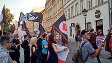 Small group of young people with various flags