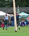 The caber strikes the ground