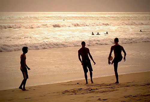 Playing football on a beach in Bali