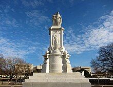 The monument, as seen from it's base. Two statues sit atop of it.