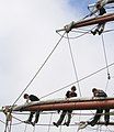 The length of chain running diagonally up and right from the bottom-left of this picture to the upper of the two yards is the fore-lower-topsail sheet. Some of the lines on Prince William's larger sails are made of chain to handle the heavy loads while remaining flexible enough to pass through the various blocks on their route to the deck.