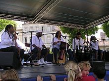 Tillery (center) performing with The Cultural Heritage Choir in July 2008