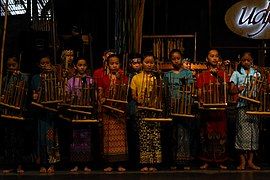 Playing Angklung.