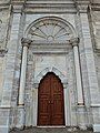 Central entrance to the courtyard, with sun motif above the doorway