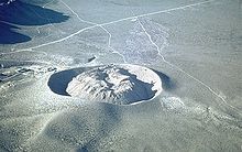 Ring of gray rock with a dome of gray rock inside it.