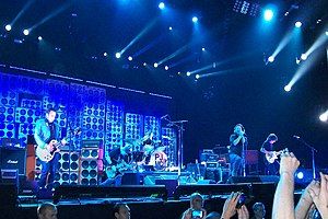 Pearl Jam performing in Amsterdam in 2012. From left to right: Mike McCready, Jeff Ament, Matt Cameron (on drums), Eddie Vedder, and Stone Gossard